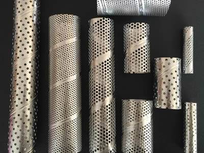 There are several perforated extruder screen tubes with various sizes.
