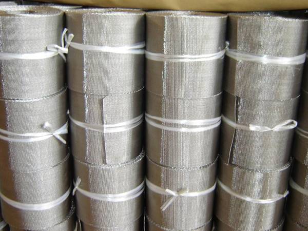 Several rolls of filter belts on the ground.