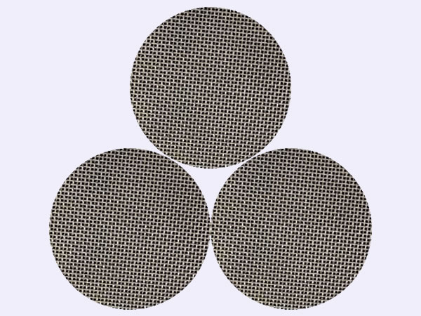 3 round extruder screens on black background.