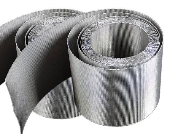 Two rolls of extruder filter belt on white background.