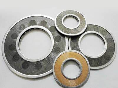 There are four ring-shaped extruder screens made of different materials.