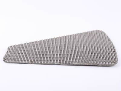 There is a trapezoidal extruder screen with multiple layers.